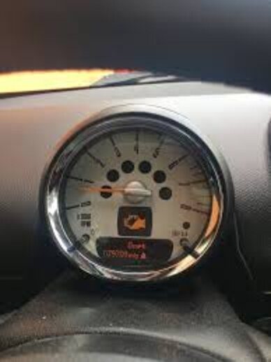 Center speedometer of the 2008 MINI Clubman S with the amber engine-malfunction icon illuminated