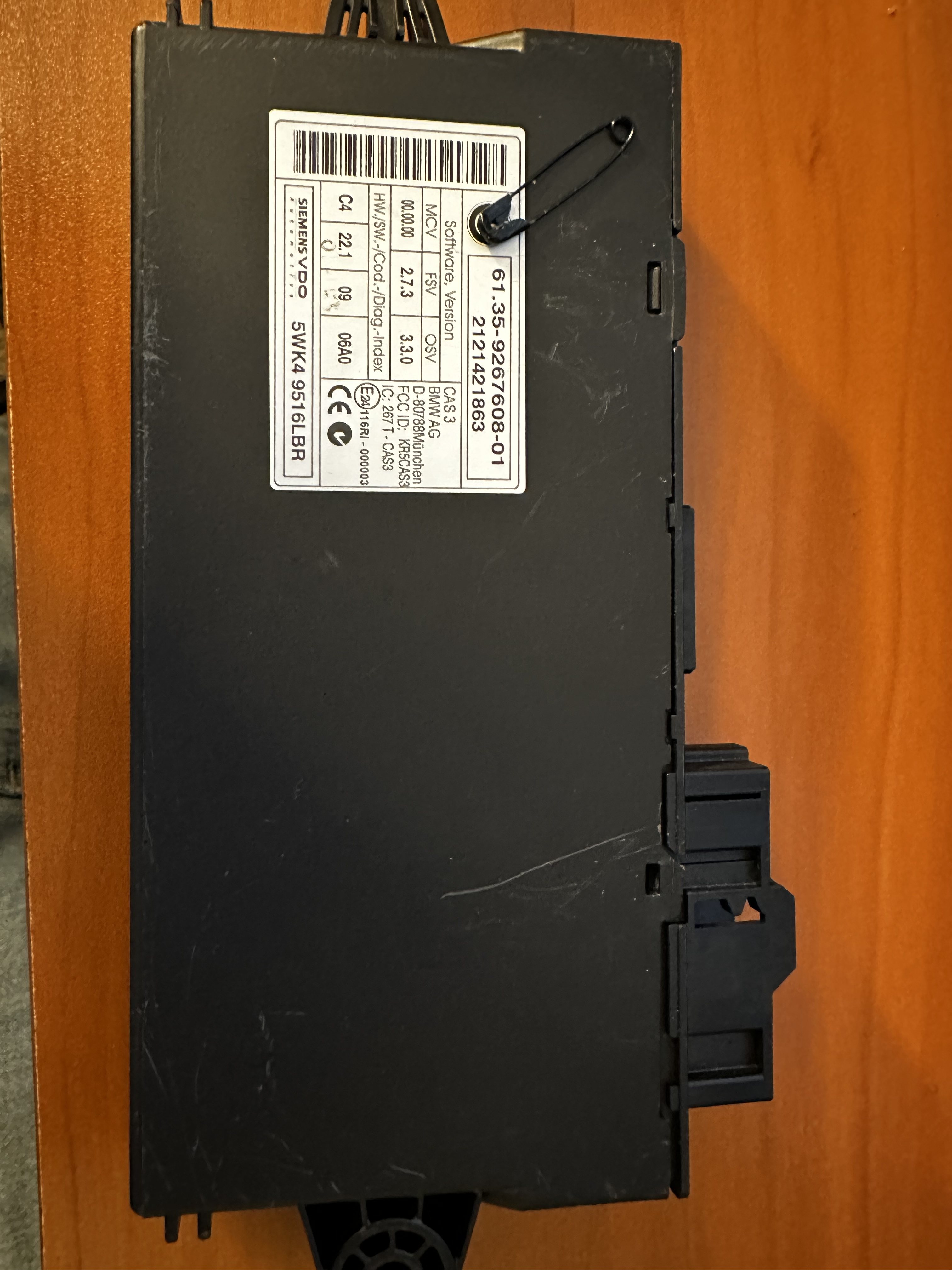 CAS3 module housing viewed from above, with its multi-pin connector block and mounting bracket at one end