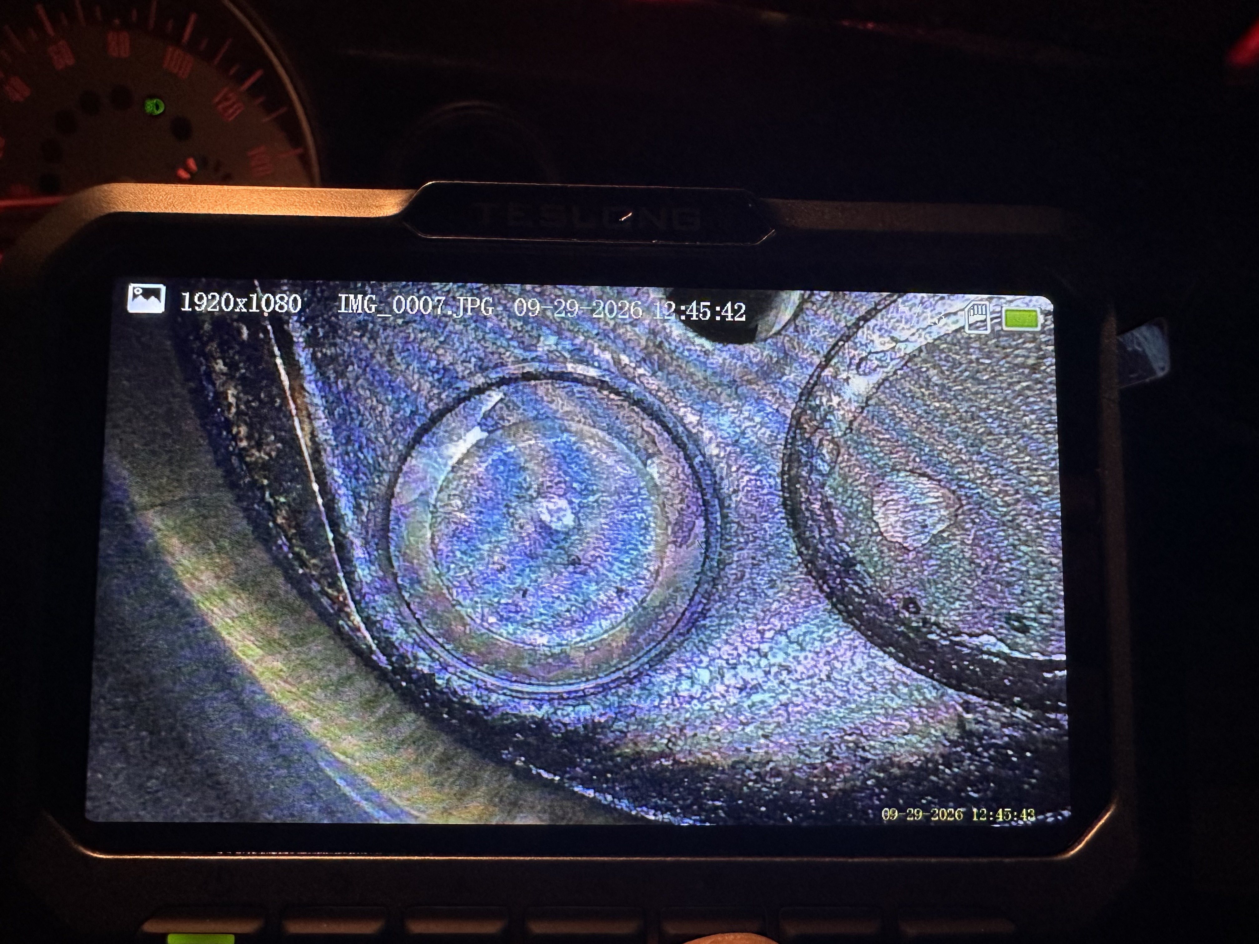 Borescope view inside cylinder 1 showing valve faces in the cylinder head from a different angle.