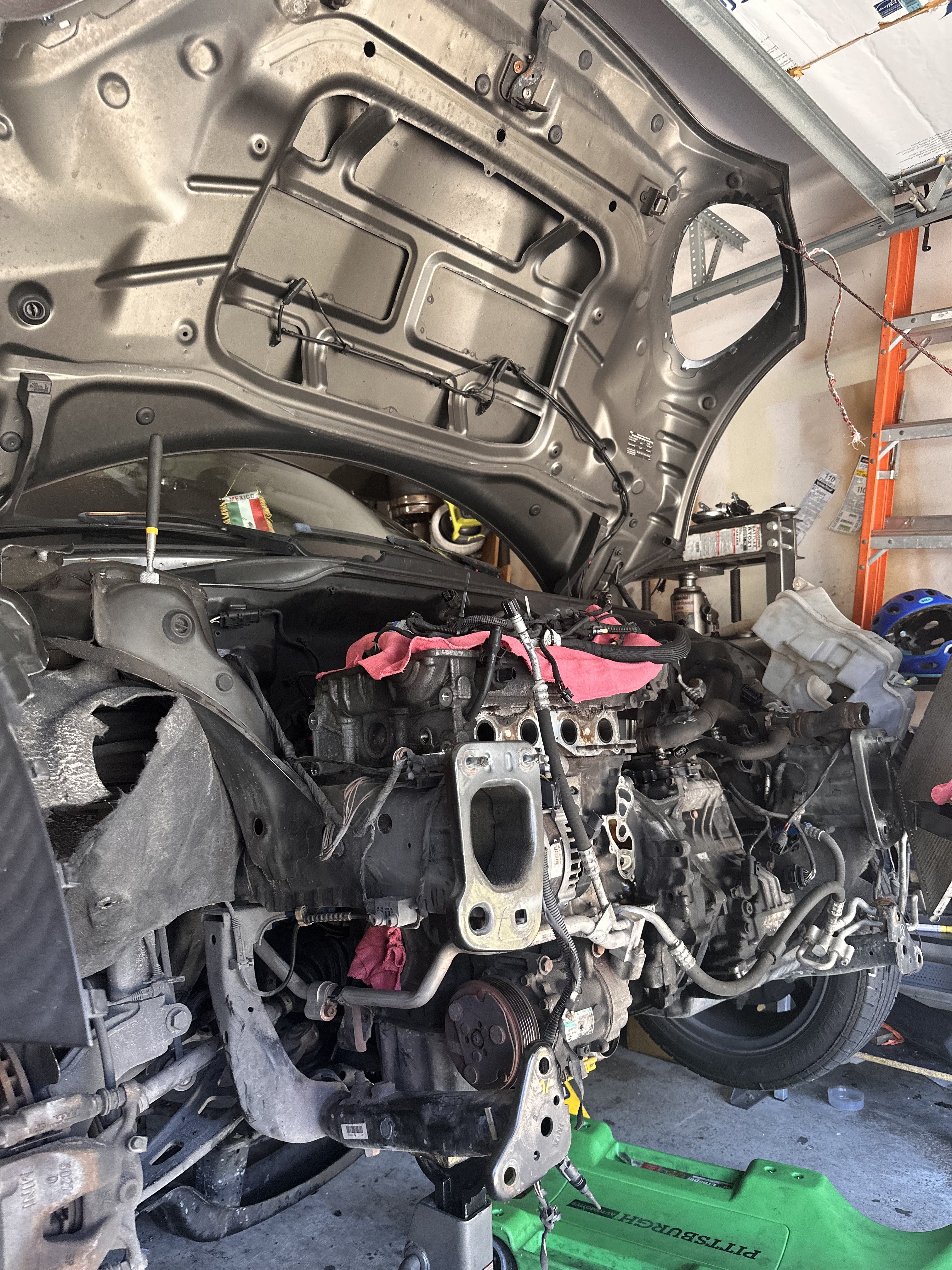 Engine bay of the 2013 MINI Paceman N16 with the cylinder head removed and the engine left in the car