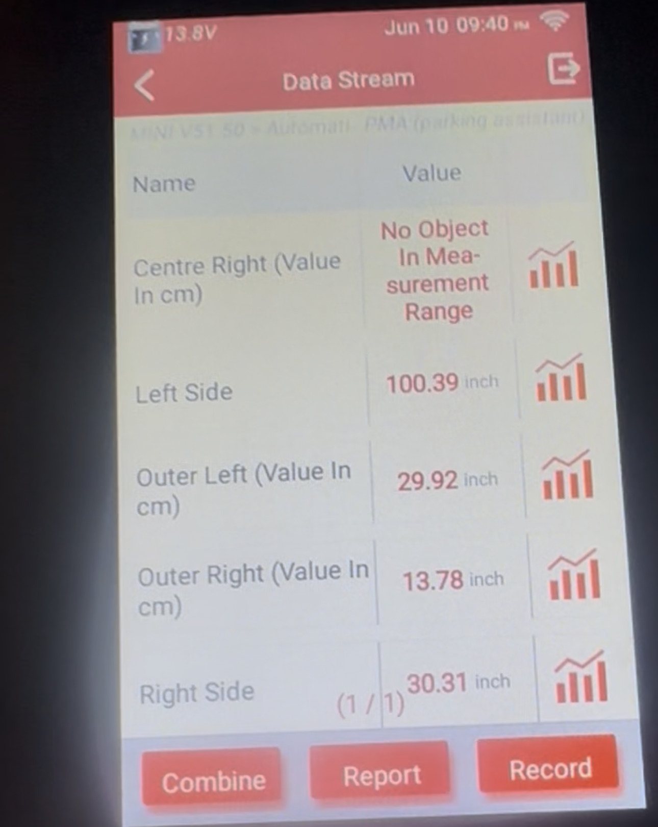 Diagnostic tablet showing a parking assistant data stream listing distance values per sensor position, including outer left and outer right
