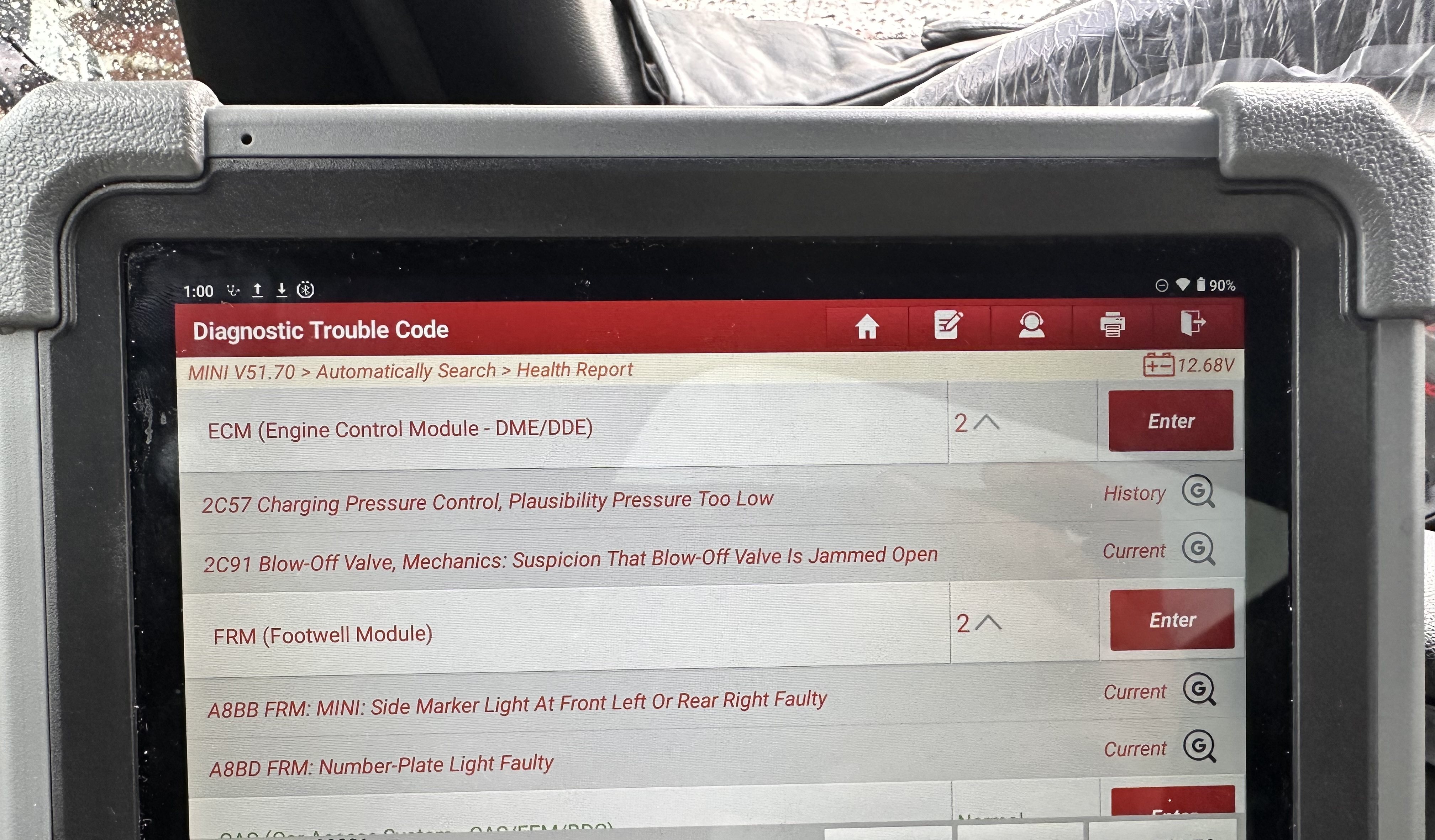 Scan tool health report listing engine faults 2C57 as history and 2C91 as current, plus footwell module faults A8BB and A8BD as current
